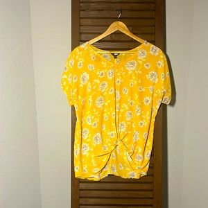 Short sleeve yellow floral blouse with knot tie waist detail. Size Medium.